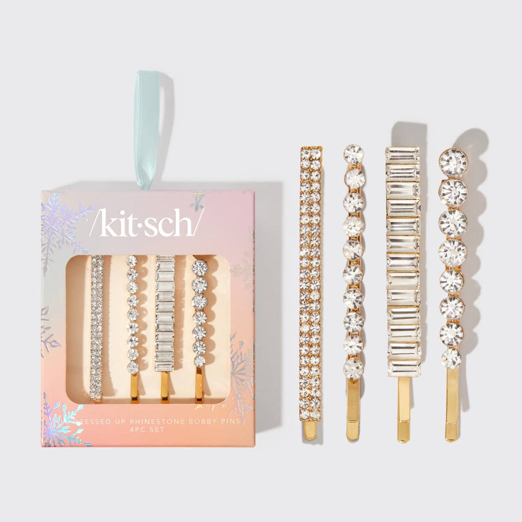 Set of decorative hair clips with 'kit-sch' packaging on a light gray background