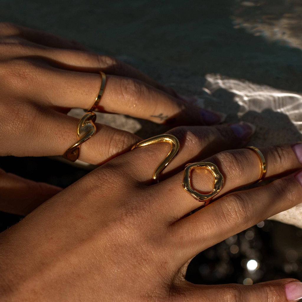 several gold rings on fingers