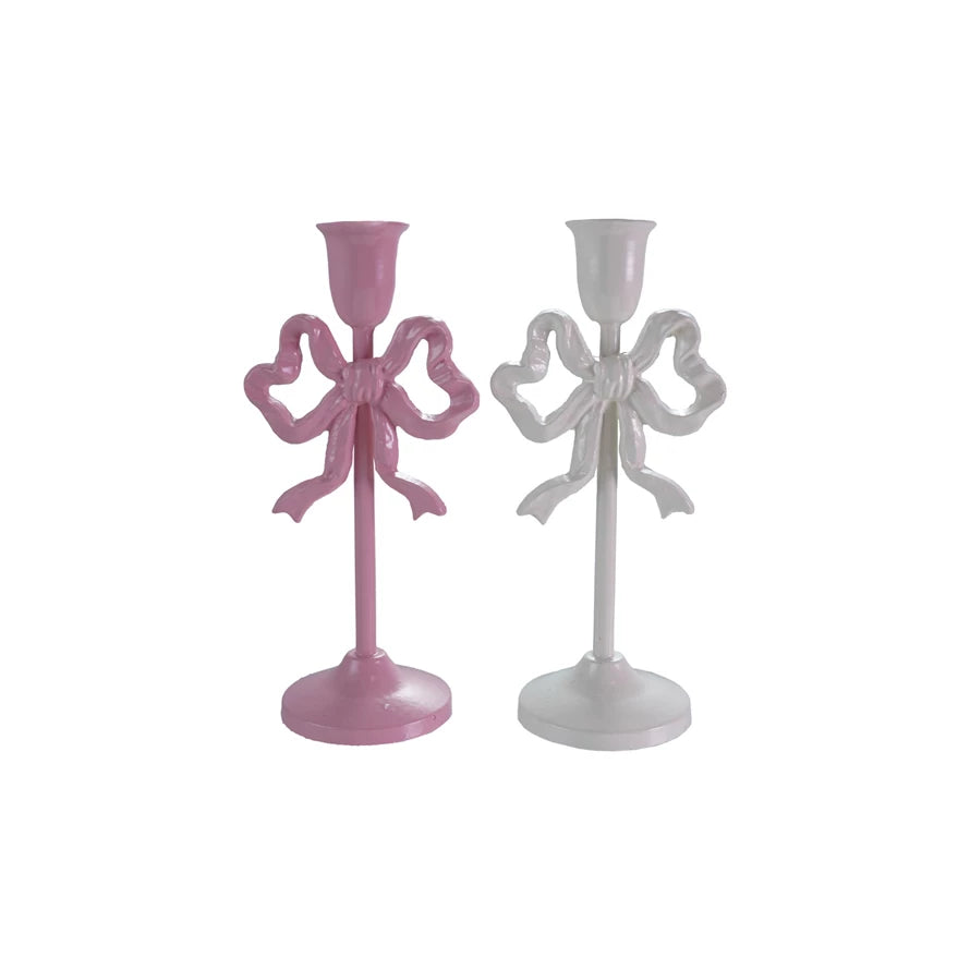 10-inch cast iron bow taper candle holders in pink (Rose Ribbon) and white (Ivory Ribbon), sold separately. Elegant bow design for romantic farmhouse or vintage décor.
