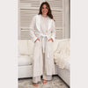Soft leopard print Harbin robe with collar and cuff detailing, worn by a woman. 
