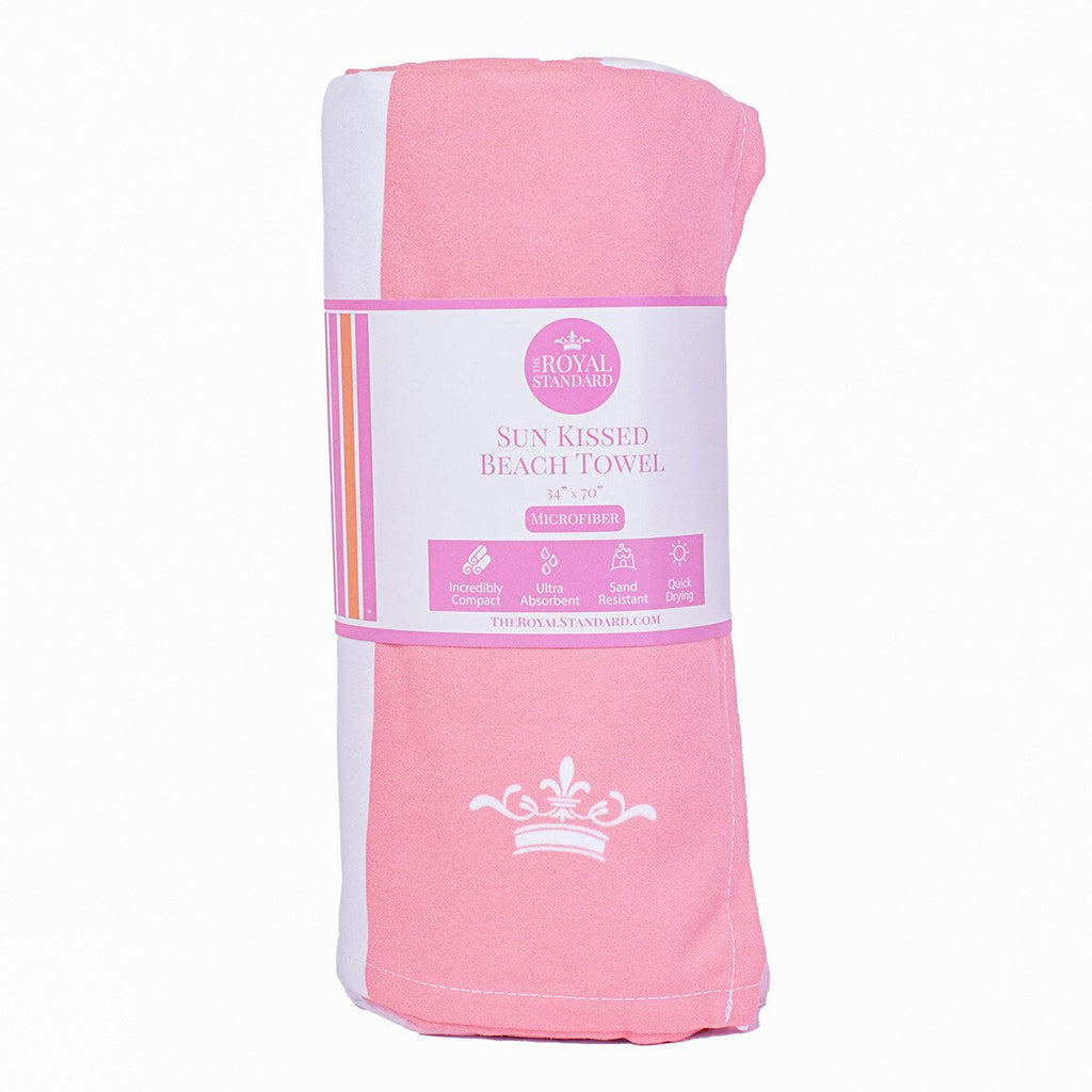 Pink beach towel with a label on a white background