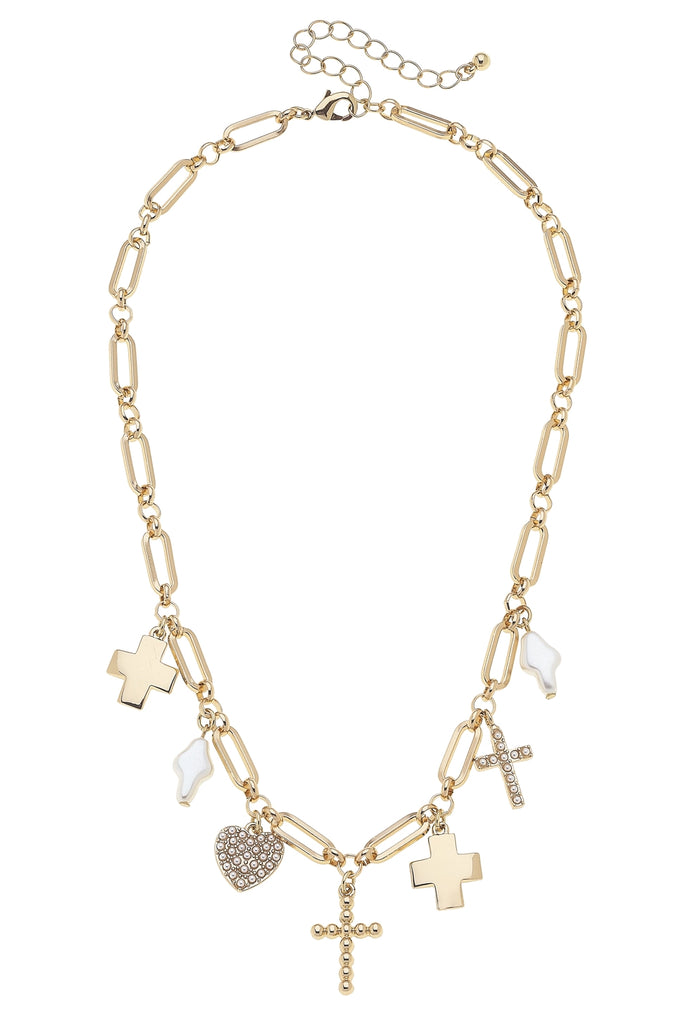 Gold necklace with various charms on a white background