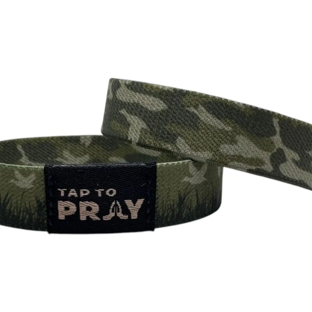 Camouflage wristband with 'Tap to Pray' text on a white background
