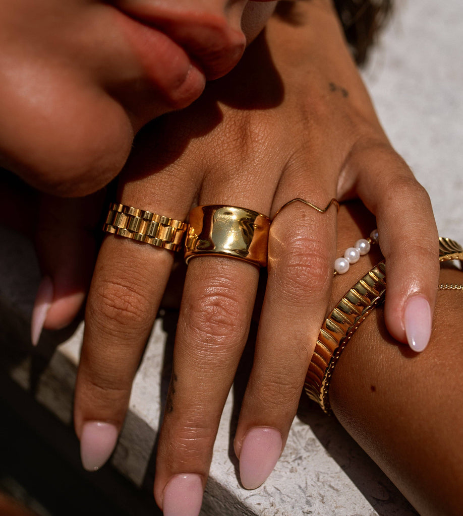 gold rings on fingers