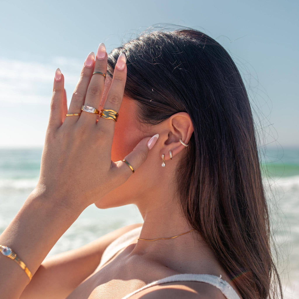 Woman with jewelry on a beach