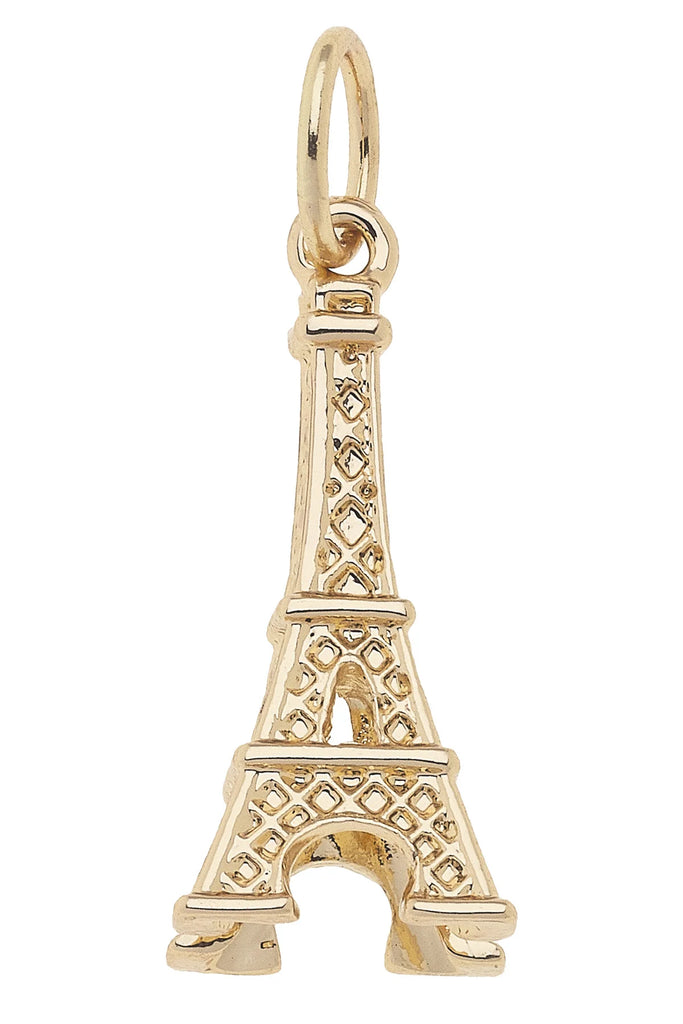 Gold Eiffel Tower charm on a white background