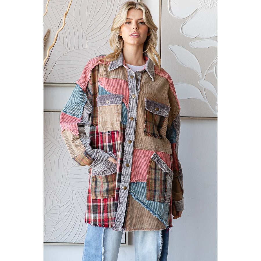 Woman wearing a patchwork coat with a neutral background