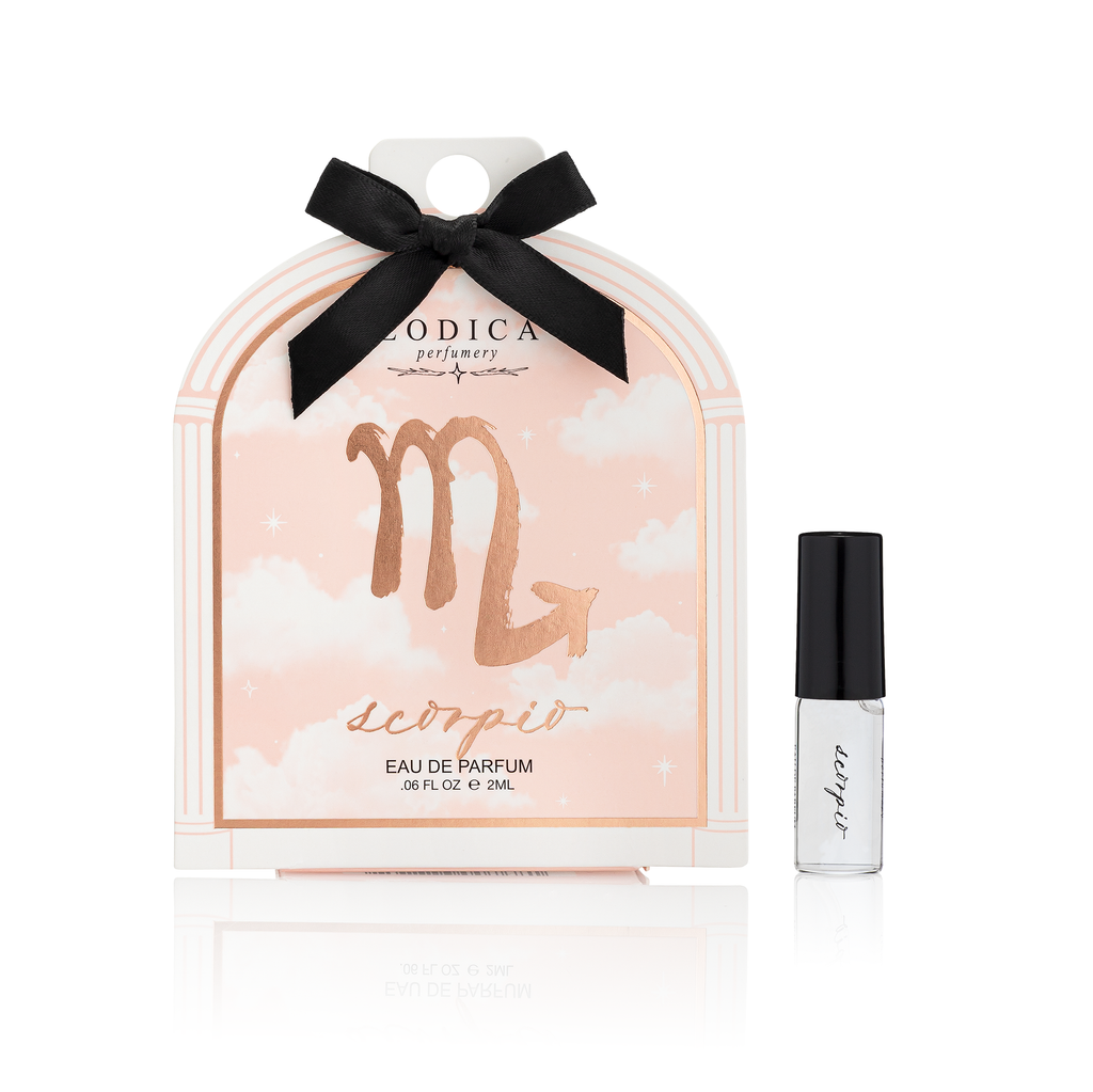 Sagittarius zodiac sign perfume packaging with a black ribbon on a white background