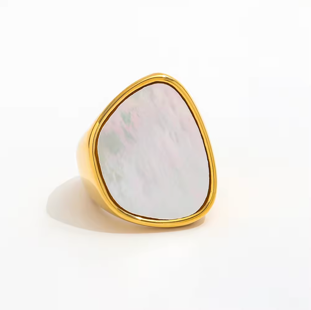 Gold ring with a large, multicolored stone on a white background