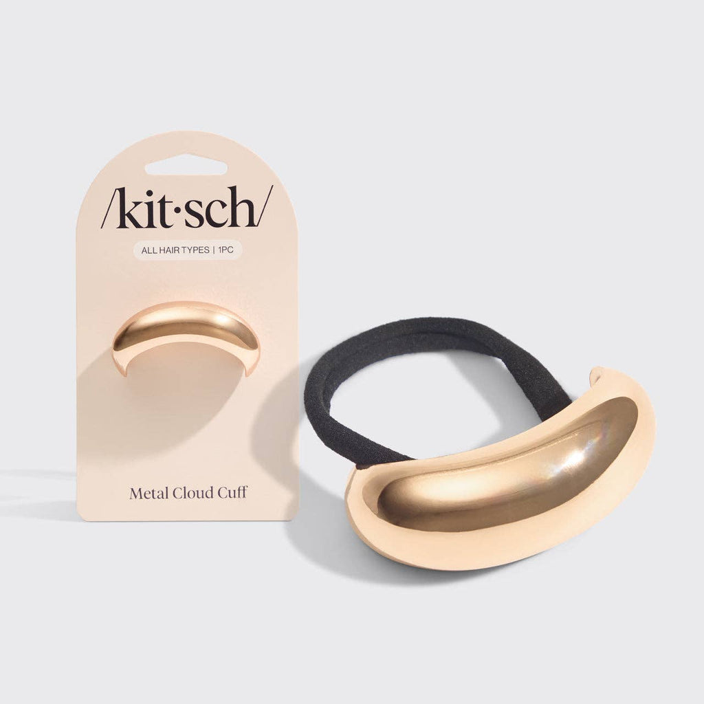 Metal cloud cuff with packaging on a light gray background