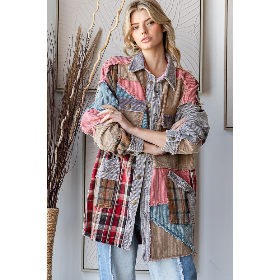 Woman wearing a patchwork jacket in a room with decorative elements