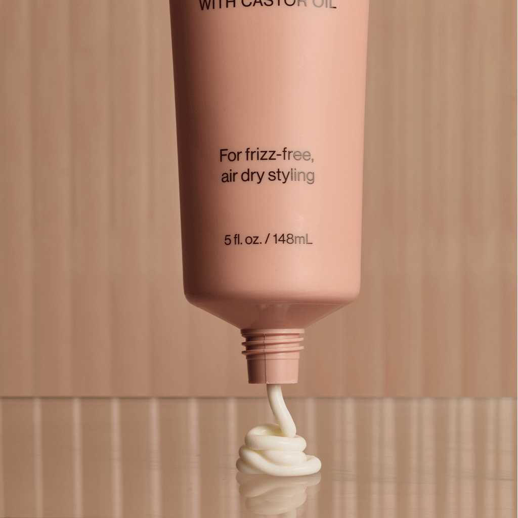 video of Kitsch Smoothing Air Dry Cream being squeezed out of bottle