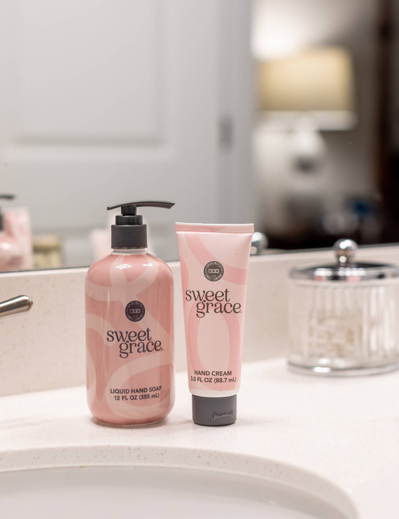 hand cream and hand soap on bathroom sink