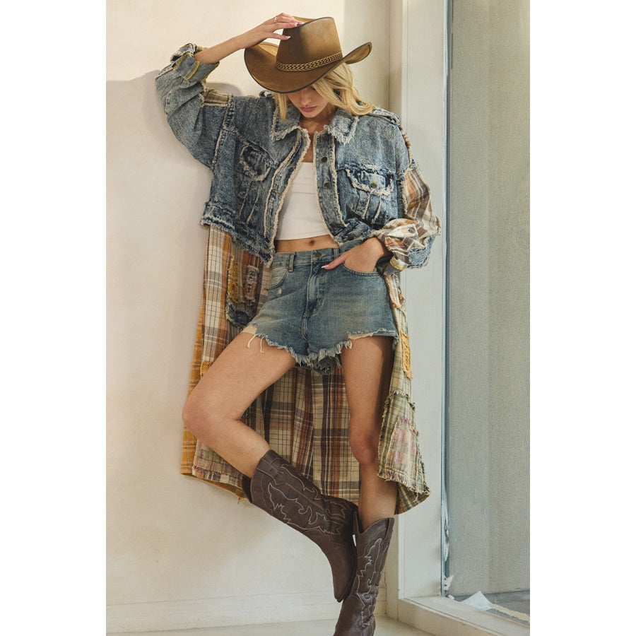 Person wearing a denim jacket, plaid shirt, shorts, and cowboy boots indoors.