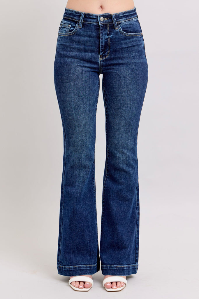 Abilene Judy Blue High Waist Dark Trouser Flare Jeans shown in dark wash denim, featuring non-distressed finish, classic 5-pocket design, wide flared hem, and button-zip closure. Displayed on light background highlighting the trouser-style silhouette and clean lines.