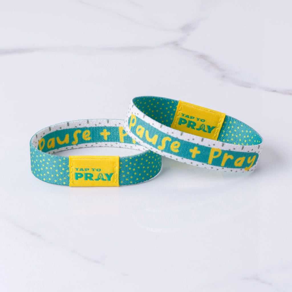 Tap To Pray Kingfolk wristbands with yellow and teal reversible design, featuring daily Bible verse NFC chip.