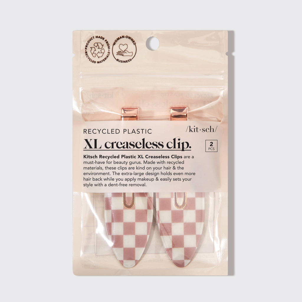 Package of Kitch XL creaseless clips with checkered design on a light gray background