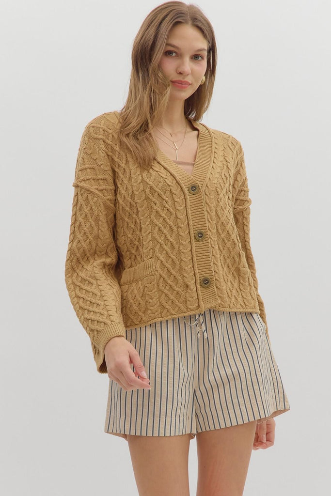 Camel cropped cable knit cardigan with long sleeves, V-neckline, front pockets, and relaxed fit
