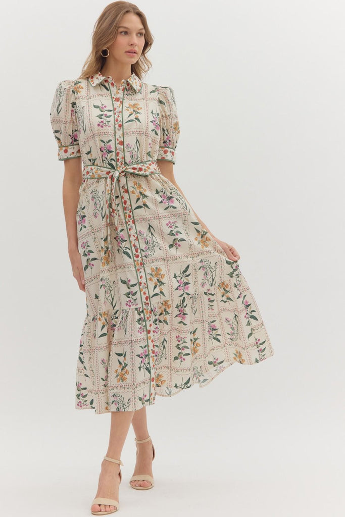 Floral print midi dress with short puff sleeves, button front closure, contrast binding, removable belt, and side pockets