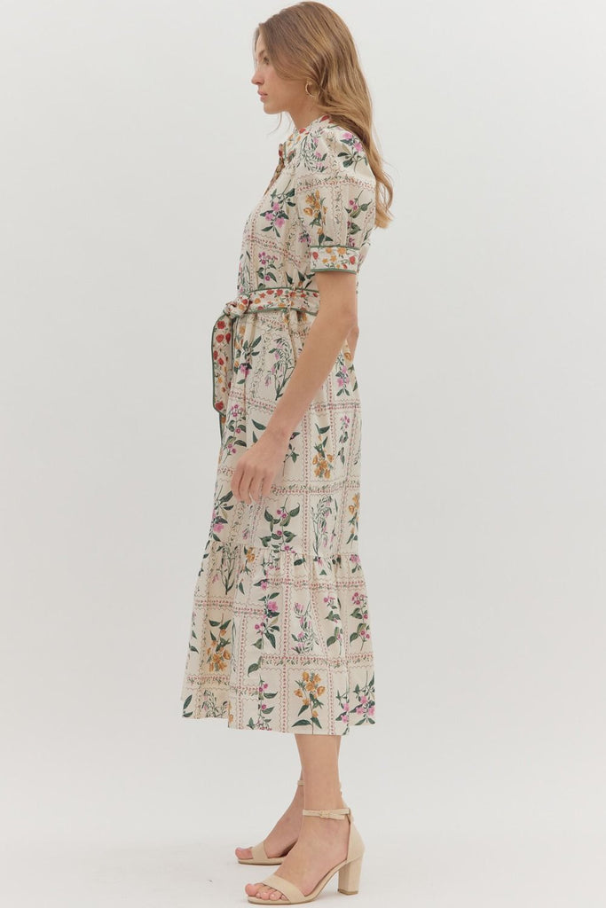 Floral print midi dress with short puff sleeves, button front closure, contrast binding, removable belt, and side pockets