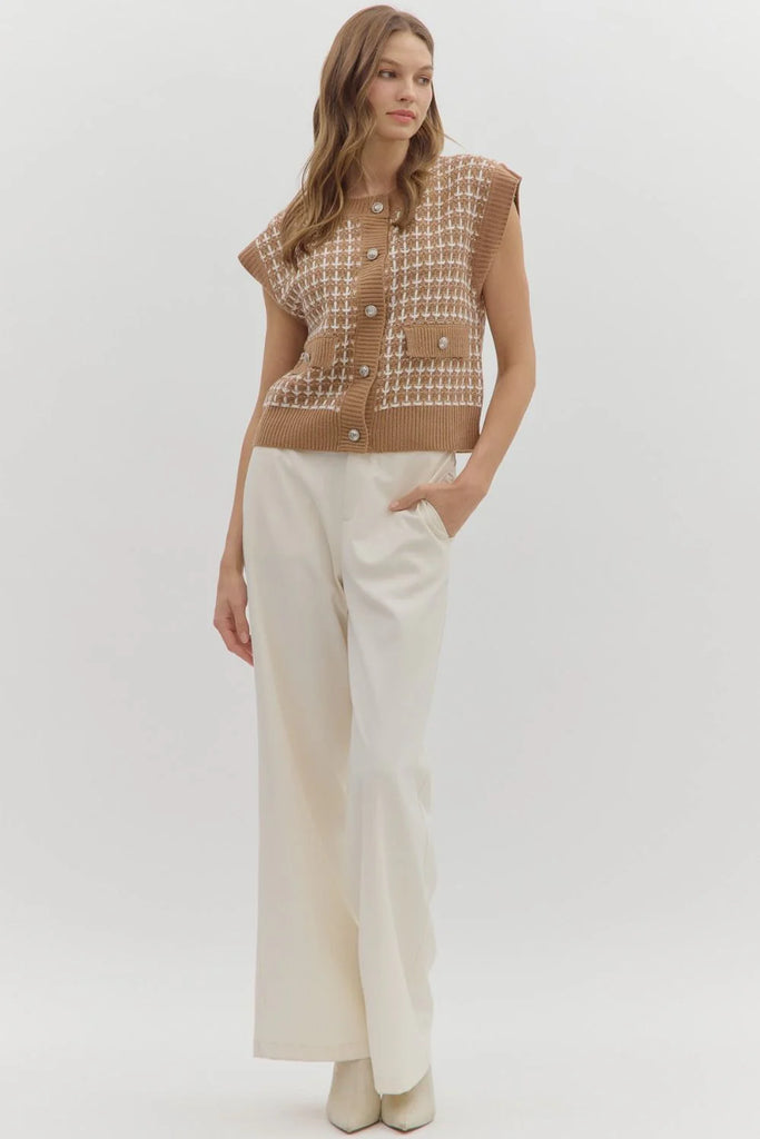 Taupe knit vest with white textured stitching, button-front closure, and front pockets.
