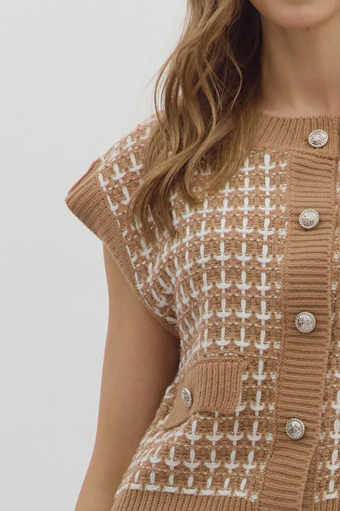 Taupe knit vest with white textured stitching, button-front closure, and front pockets.