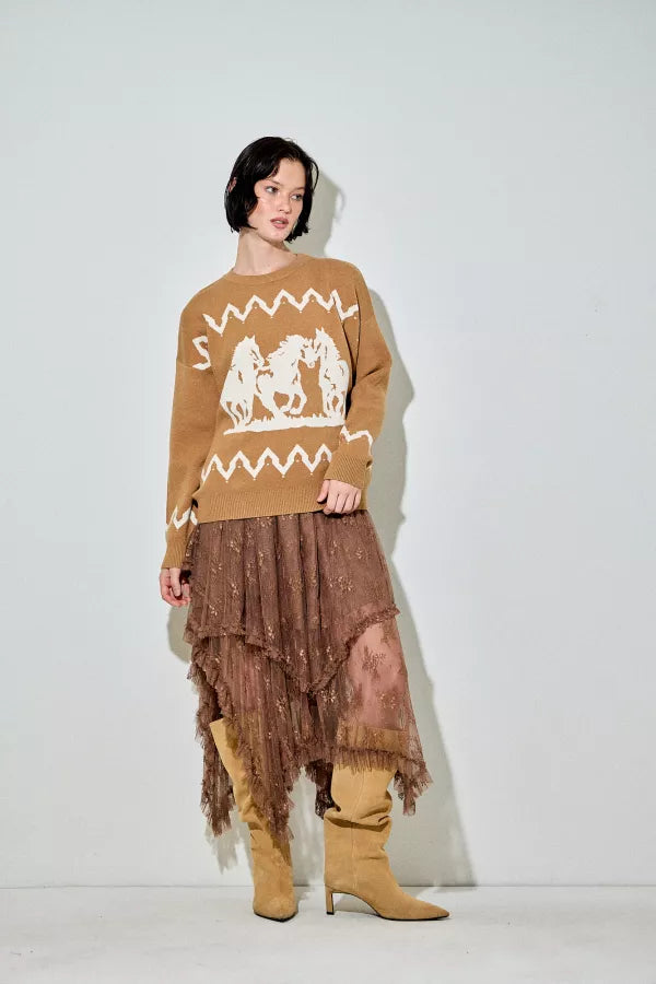 A camel-colored crewneck sweater with a large white graphic of three running horses on the front and white zigzag patterns above and below the main graphic.