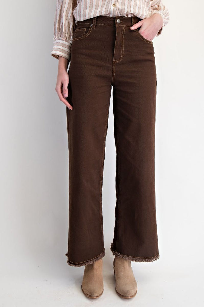 Coffee brown high-waisted straight-leg washed twill pants with raw frayed hem, five-pocket design, and button-zip fly