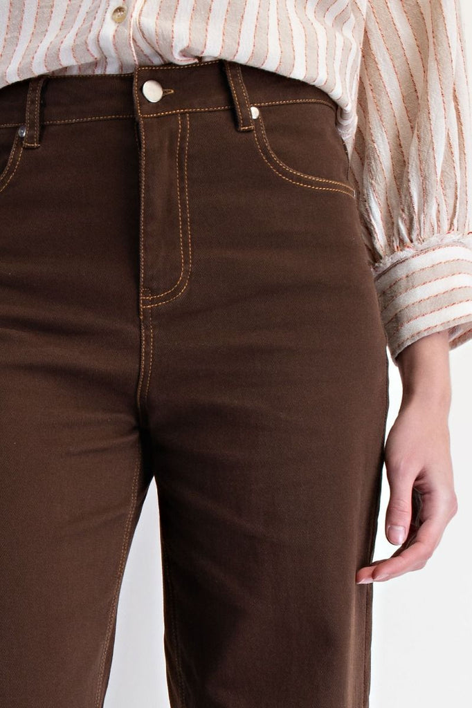 Coffee brown high-waisted straight-leg washed twill pants with raw frayed hem, five-pocket design, and button-zip fly