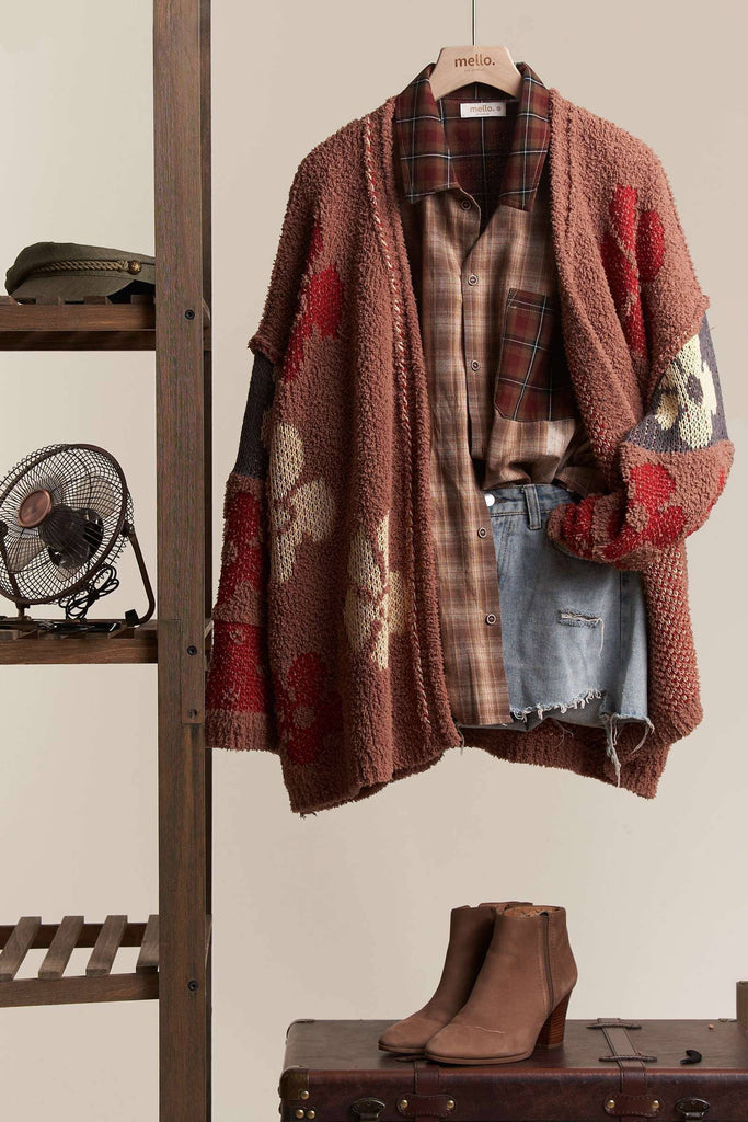 Oversized terry knit cardigan in brown with multicolor floral and stripe patterns.