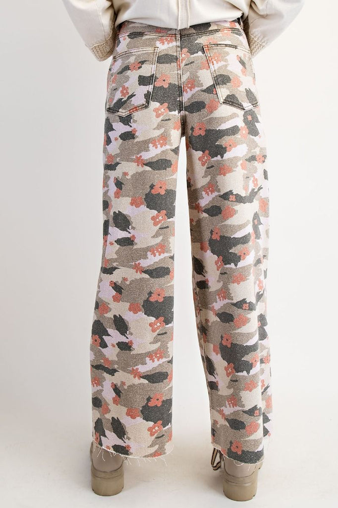 Wide-leg floral camo pants with raw hem by Easel, featuring coral flowers and neutral tones.