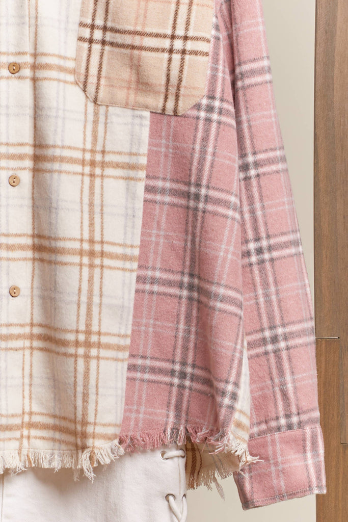 Oversized multi-plaid shacket in beige, cream, and blush with raw-edge hem and chest pocket.