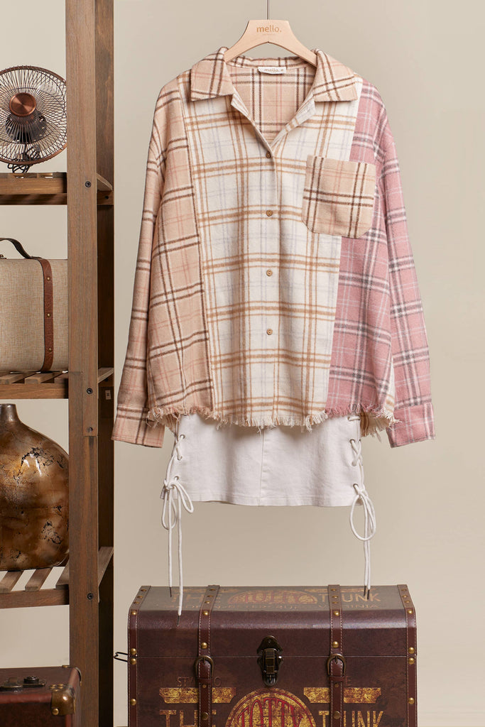 Oversized multi-plaid shacket in beige, cream, and blush with raw-edge hem and chest pocket.