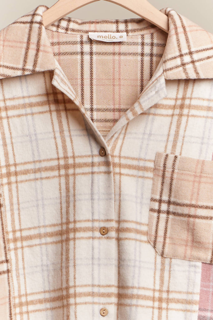 Oversized multi-plaid shacket in beige, cream, and blush with raw-edge hem and chest pocket.