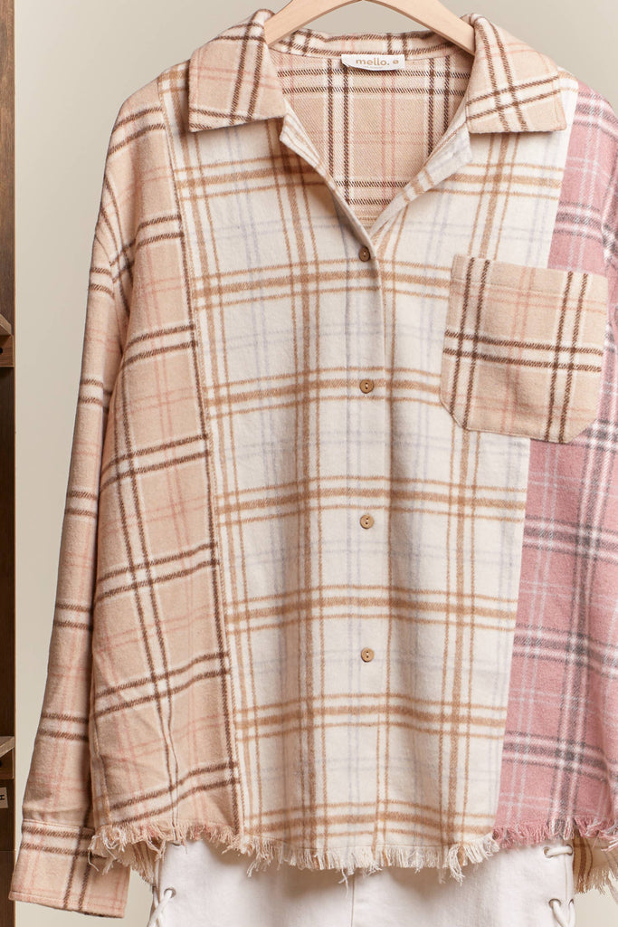 Oversized multi-plaid shacket in beige, cream, and blush with raw-edge hem and chest pocket.
