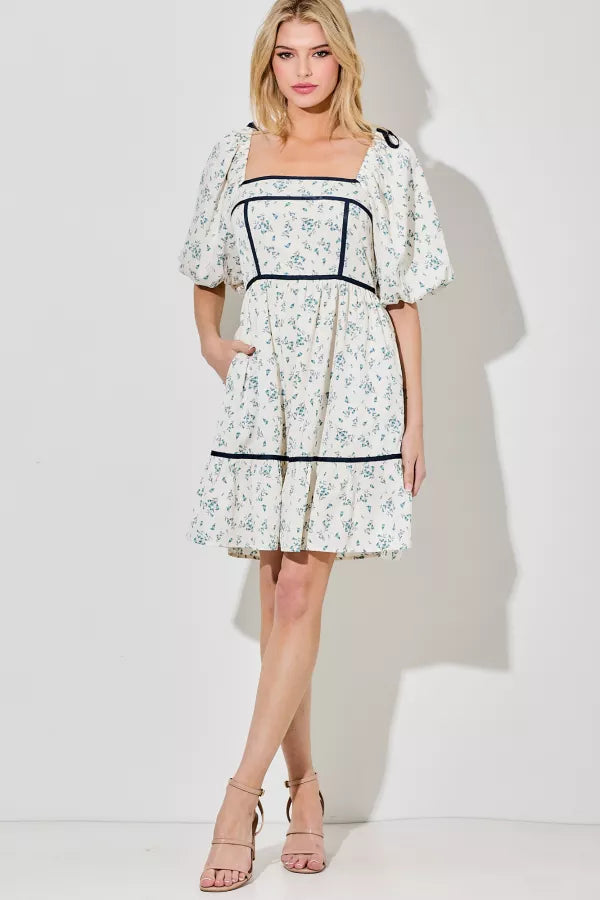BUBBLE SHORT SLEEVE +SKIRT BOTTOM RUFFLE +COLOR BLOCK DETAIL +SHOULDER BOW DETAIL 