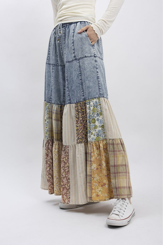 Patchwork wide-leg denim pants with floral, plaid, and striped fabric panels in earthy tones, boho boutique style