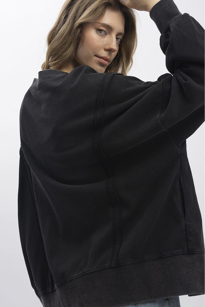 Euphemia leopard peace sign sweatshirt in washed black with a large animal print graphic, a relaxed fit, and distressed raw hem.