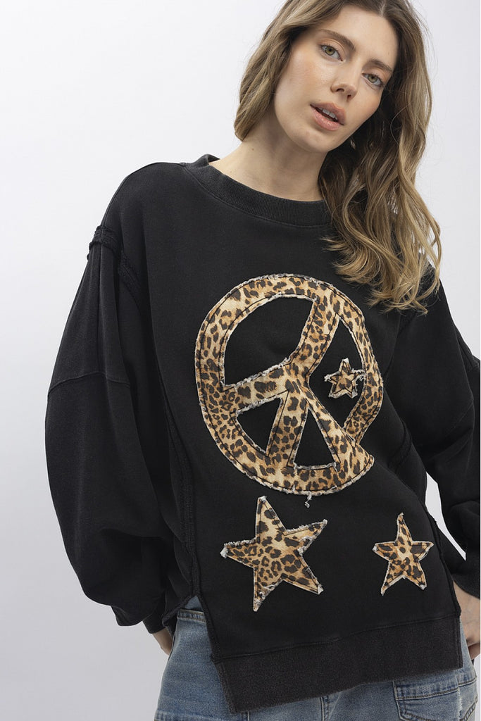 Euphemia leopard peace sign sweatshirt in washed black with a large animal print graphic, a relaxed fit, and distressed raw hem.