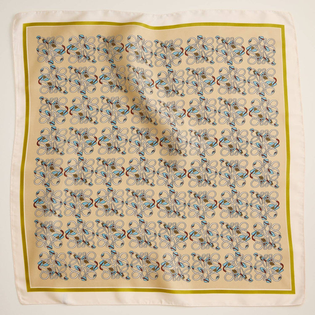 Beige geometric patterned square scarf with silky texture and decorative border.