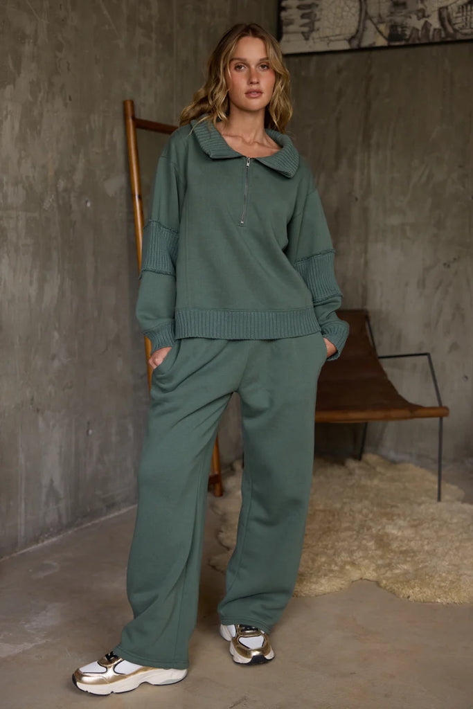 "Vintage Havana Olive Fleece Collared Quarter-Zip Pullover featuring a soft fleece fabric, ribbed accents, and relaxed silhouette for elevated lounge and athleisure styling."