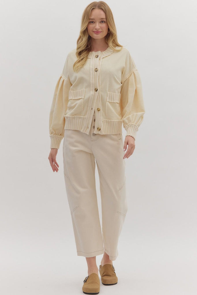 The Genan cardigan is your go-to for cozy structure with a touch of edge. Crafted in a soft neutral knit, it features wide ribbed trim at the hem and patch pockets, accented with subtle raw edges for a casual, lived-in vibe. With a boxy fit and button-up front, this medium-weight layer blends comfort and refinement for everyday ease.