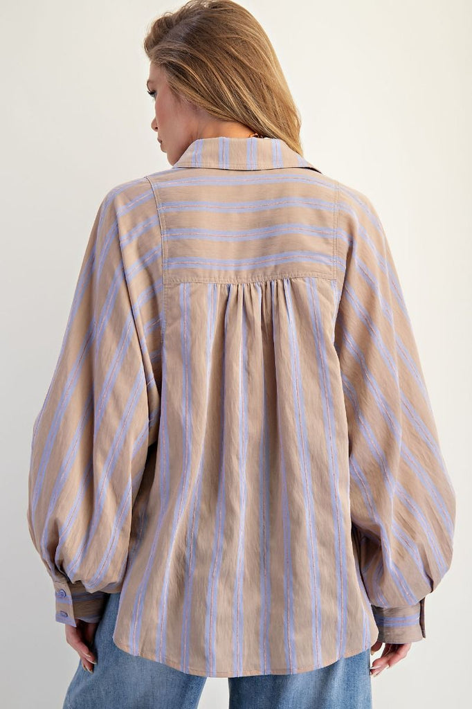 A mushroom-colored oversized button-down shirt with light blue yarn-dyed stripes. The shirt has a collar, a button front, and dramatic long balloon sleeves.