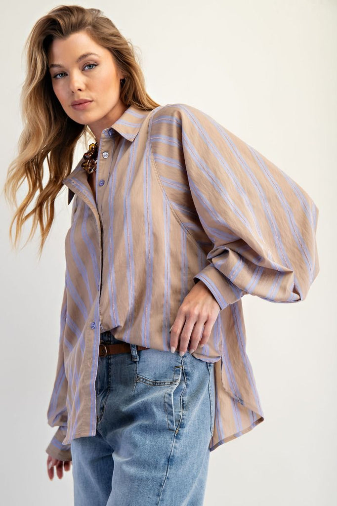 A mushroom-colored oversized button-down shirt with light blue yarn-dyed stripes. The shirt has a collar, a button front, and dramatic long balloon sleeves.