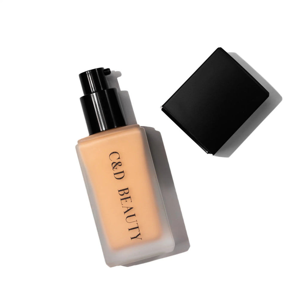 Foundation bottle with black cap on a white background, featuring 'C&D Beauty' branding.