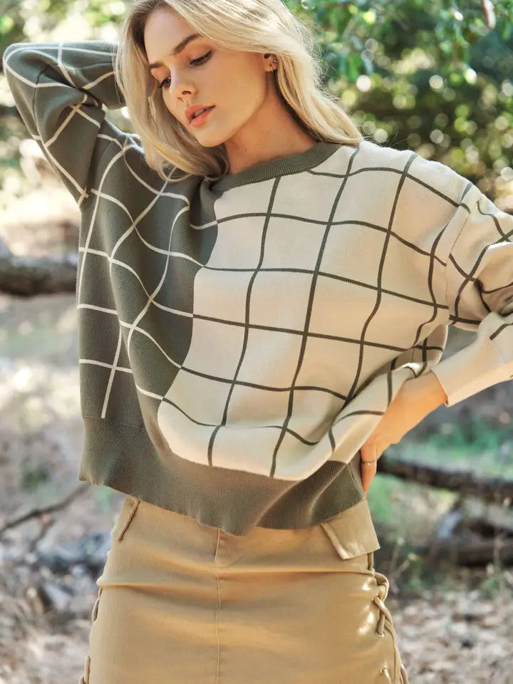 Olive and cream plaid grid knit sweater with crew neckline, long sleeves, and relaxed fit