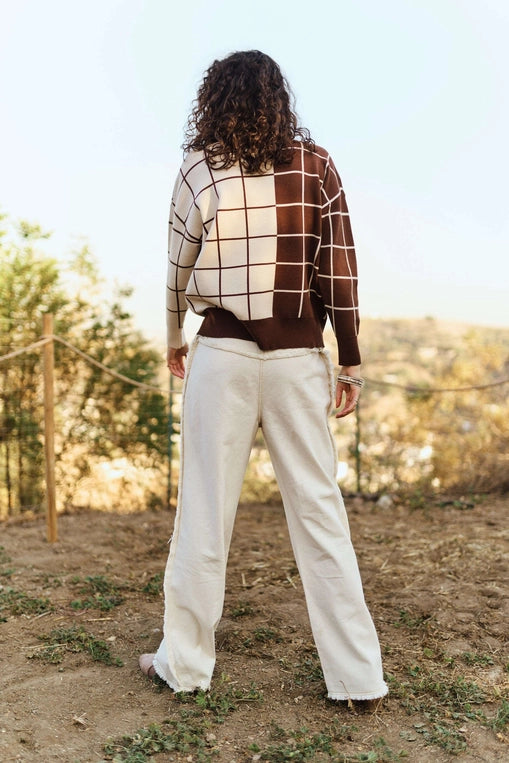 Brown and cream plaid grid knit sweater with crew neckline, long sleeves, and relaxed fit