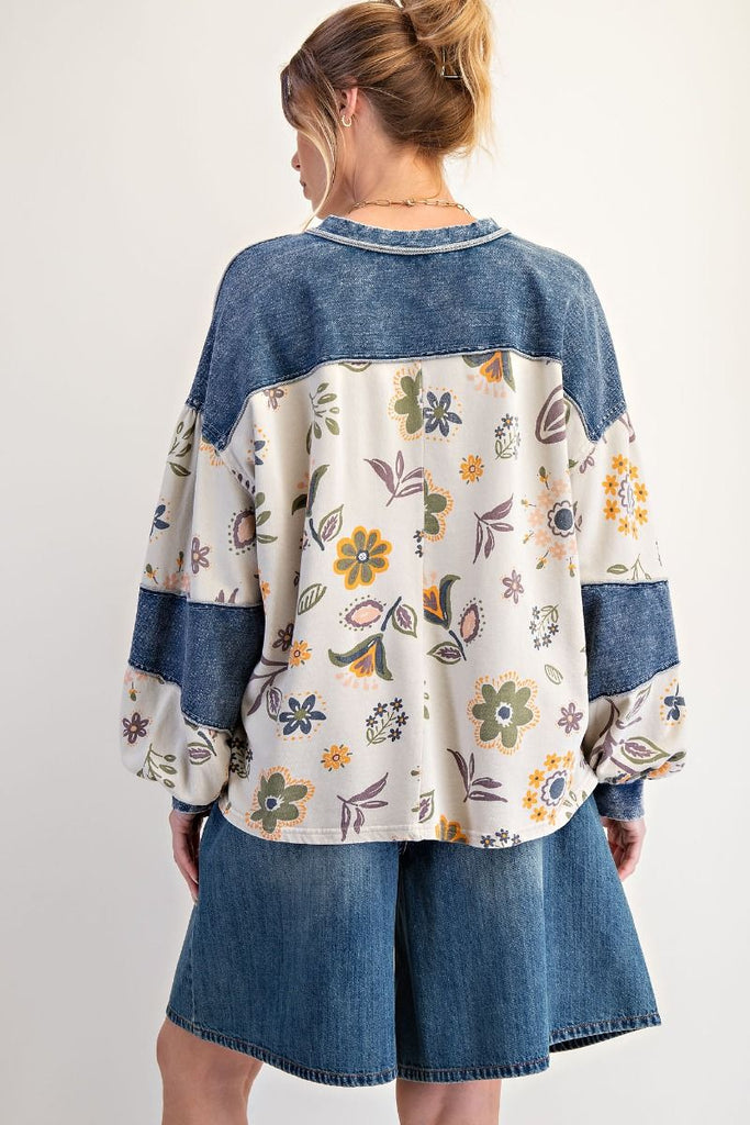 Isolde floral denim patchwork sweatshirt in ecru with muted floral print and dark wash denim accents on the shoulder and chest pocket, styled with a casual fit.