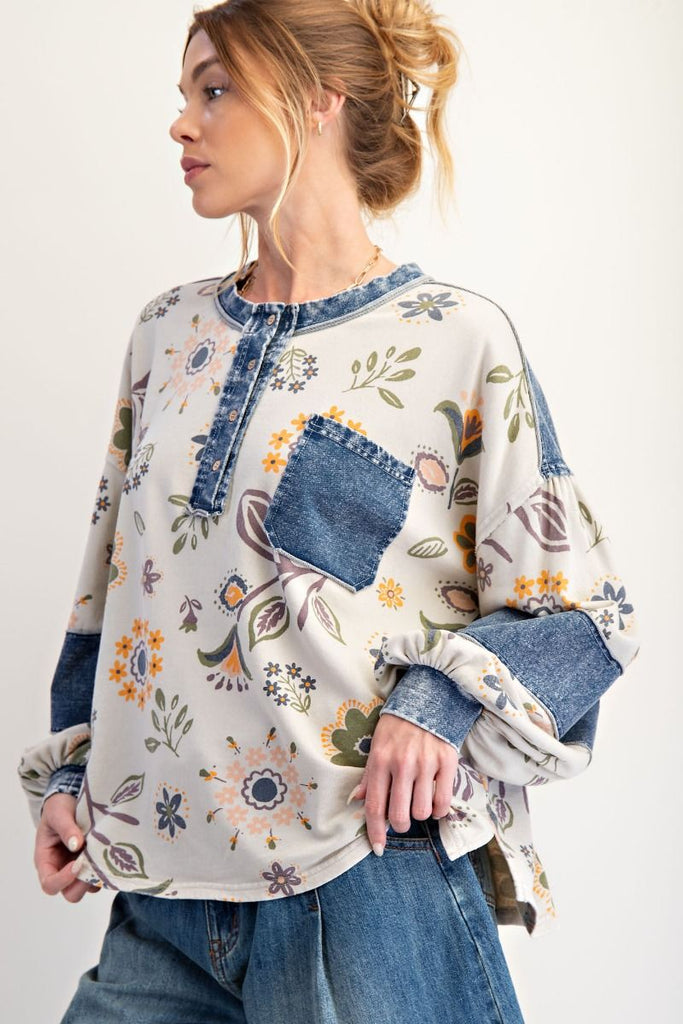 Isolde floral denim patchwork sweatshirt in ecru with muted floral print and dark wash denim accents on the shoulder and chest pocket, styled with a casual fit.