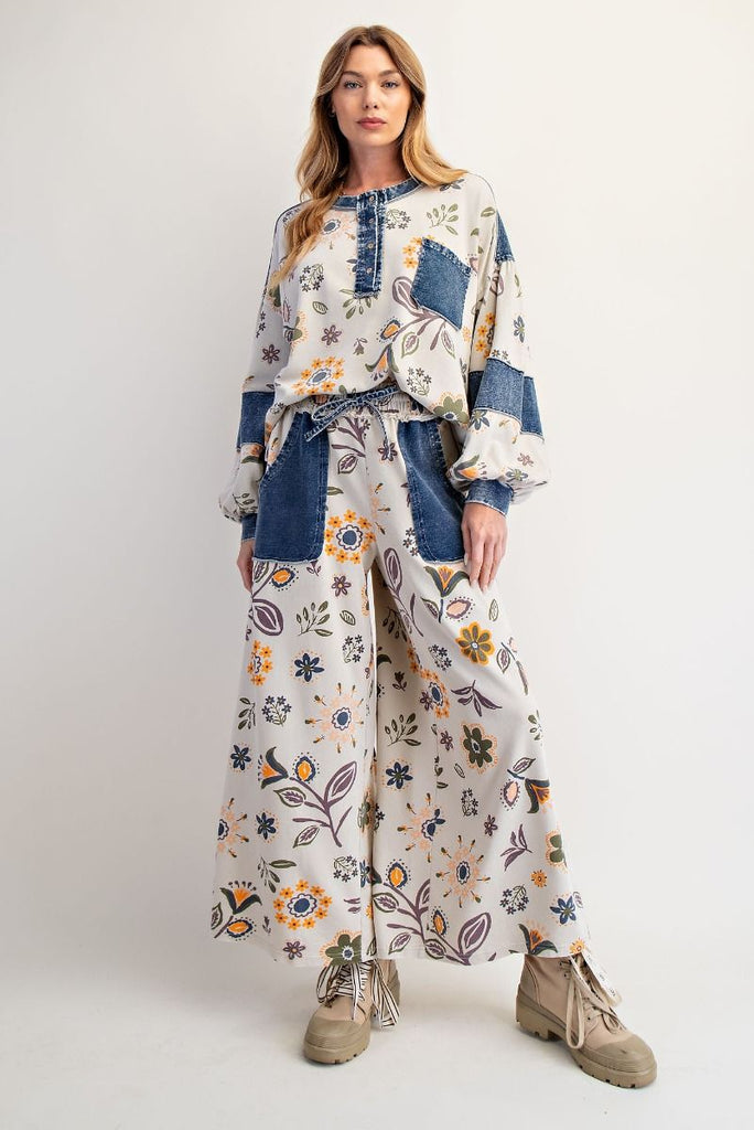 Isolde floral denim patchwork sweatshirt in ecru with muted floral print and dark wash denim accents on the shoulder and chest pocket, styled with a casual fit.